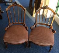 A pair of Victorian nursing chairs with spindle ba