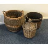 A wicker log basket together with an old barrel et