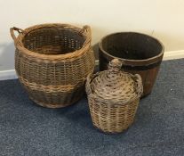 A wicker log basket together with an old barrel et