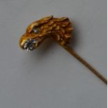 An Antique stick pin in the form of an eagle's hea