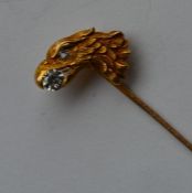 An Antique stick pin in the form of an eagle's hea