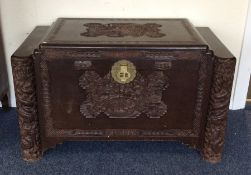 A carved camphor wood trunk. Est. £30 - £50.