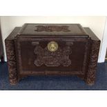 A carved camphor wood trunk. Est. £30 - £50.