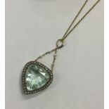 A massive aquamarine heart shaped drop pendant in