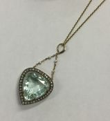 A massive aquamarine heart shaped drop pendant in