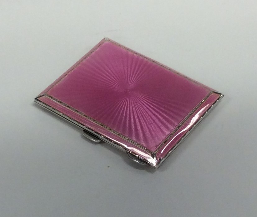 A silver and pink enamelled cigarette box. Birming