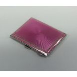 A silver and pink enamelled cigarette box. Birming