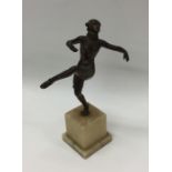 A stylish model of a dancer on square base. Est. £