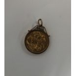A 1911 full sovereign mounted as a pendant with lo