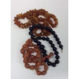 A graduated string of amber type beads together wi
