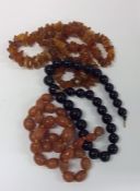 A graduated string of amber type beads together wi