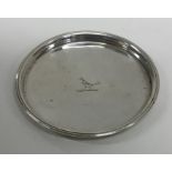 A circular silver Georgian Irish dish with crested