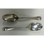 A rat tail silver spoon together with one other. A