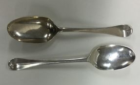 A rat tail silver spoon together with one other. A