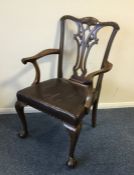A Georgian style carver chair on ball and claw fee