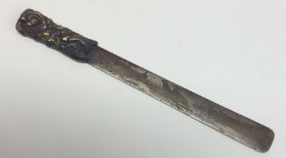 A Japanese Shakudo paper knife. Est. £30 - £40.