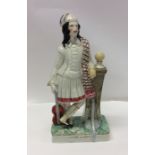 A tall Staffordshire figure of a gentleman on squa