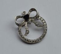 A large attractive onyx and diamond brooch in the