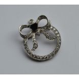 A large attractive onyx and diamond brooch in the