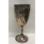 A large embossed silver goblet decorated with flow