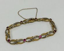 A pink sapphire and high carat gold brooch decorat