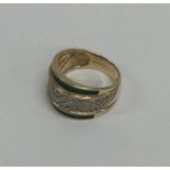 A 9 carat enamel and diamond ring. Approx. 6 grams