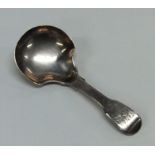 A Georgian silver fiddle pattern caddy spoon. Lond