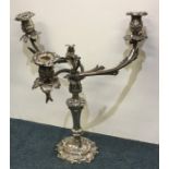 A Victorian Old Sheffield plated candelabrum embos