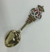 A good quality French silver gilt and enamel spoon