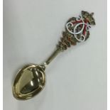 A good quality French silver gilt and enamel spoon