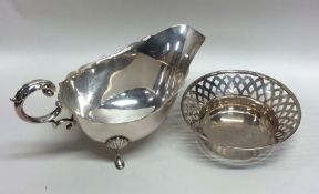An Edwardian silver sauce boat together with a pie