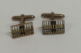 A pair of 14 carat gold cufflinks in the form of a