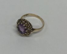 An amethyst single stone ring in claw mount. Appro