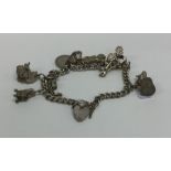 A small silver charm bracelet with heart shaped pa