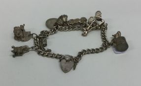 A small silver charm bracelet with heart shaped pa