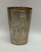 A fine quality silver gilt tapering Indian beaker