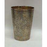 A fine quality silver gilt tapering Indian beaker