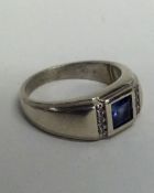 A diamond mounted ring with large central stone in