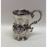 A small Victorian silver chased christening cup de