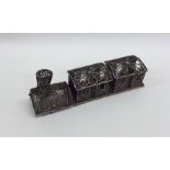 A novelty silver filigree model of a train. Approx