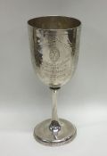 A Victorian silver engraved goblet with bead edge.