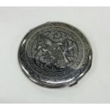 A heavy silver Eastern compact with Niello decorat