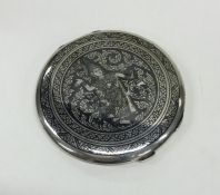 A heavy silver Eastern compact with Niello decorat