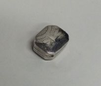 A Georgian silver miniature vinaigrette decorated