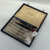 A box containing Morden and other silver pencils.