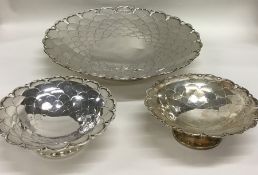 A heavy set of three graduated silver sweet dishes