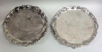 A rare pair of Georgian Irish silver waiters with