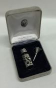 A small silver mounted miniature scent bottle with