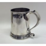 A rare Queen Anne tapering silver mug on spreading
