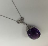 An attractive faceted amethyst drop pendant on fin